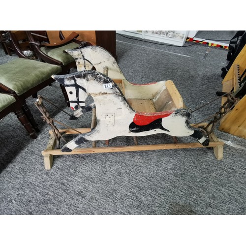 532 - A good quality very old antique double sided rocking horse with a seat to the middle on a wooden and... 