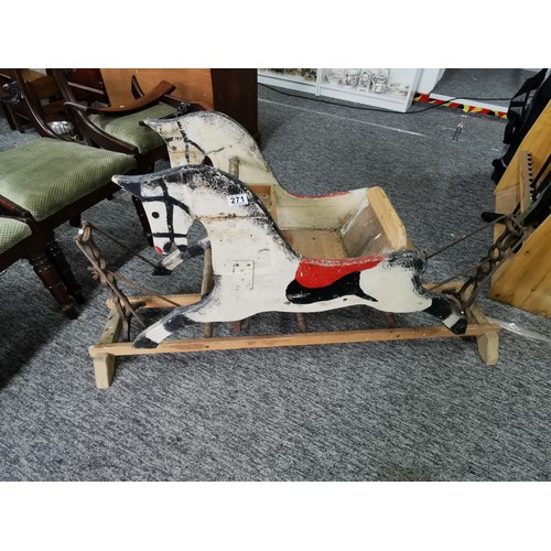 532 - A good quality very old antique double sided rocking horse with a seat to the middle on a wooden and... 