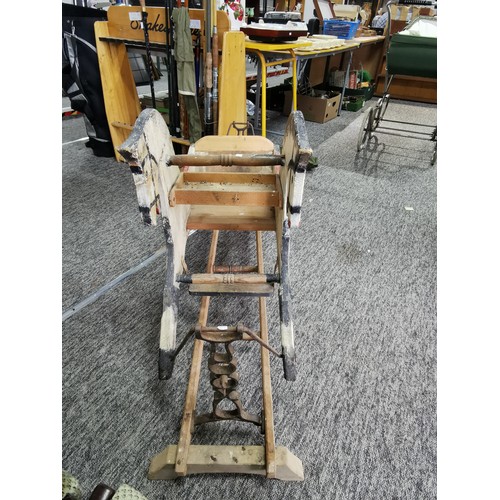 532 - A good quality very old antique double sided rocking horse with a seat to the middle on a wooden and... 