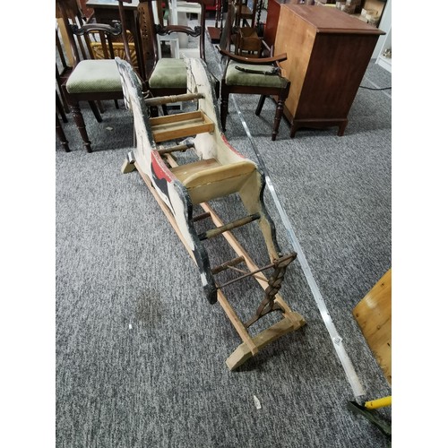 532 - A good quality very old antique double sided rocking horse with a seat to the middle on a wooden and... 