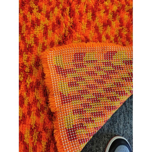 490 - A large red thick pile red and yellow rug in very clean condition along with 2 handmade crocheted ba... 