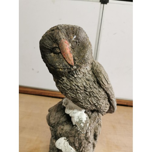 437 - Tall concrete ornament of an Owl standing on a wooden log in weathered condition stands at 54cm high