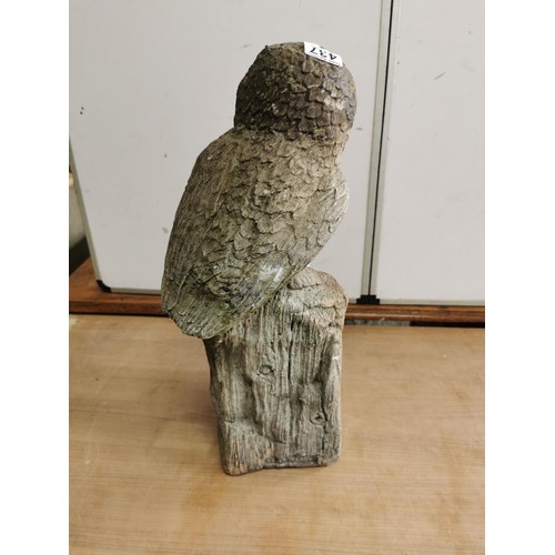 437 - Tall concrete ornament of an Owl standing on a wooden log in weathered condition stands at 54cm high