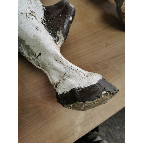 443 - 2x concrete horses that fasten into the ground on steel bars, both are well weathered measure 53cm h... 