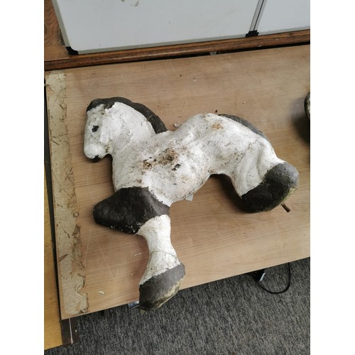 443 - 2x concrete horses that fasten into the ground on steel bars, both are well weathered measure 53cm h... 