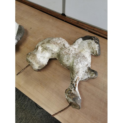 443 - 2x concrete horses that fasten into the ground on steel bars, both are well weathered measure 53cm h... 