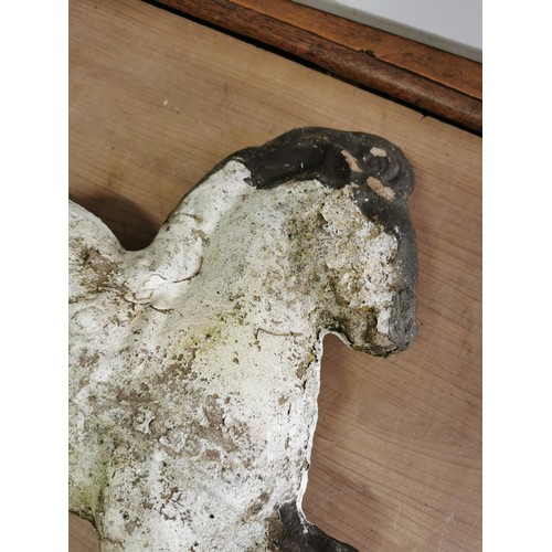 443 - 2x concrete horses that fasten into the ground on steel bars, both are well weathered measure 53cm h... 