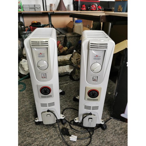 449 - 2x Delonghi Dragon electric heaters along with a boxed halogen heater, heaters stand at 65cm high