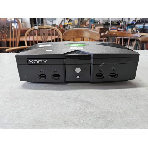 1 - An original Xbox console, no cables or controllers included.
