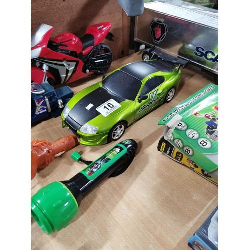 16 - A large collection of toys including die cast vehicles and figures, including many plastic McDonald ... 