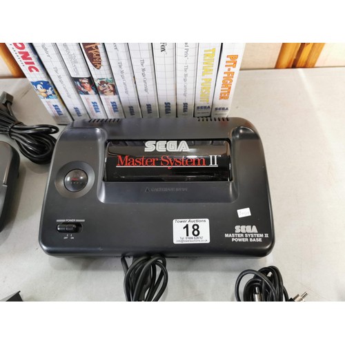 18 - A Rare Sega Master II games console, including controller and a Quickshot Atari Commodore joystick a... 