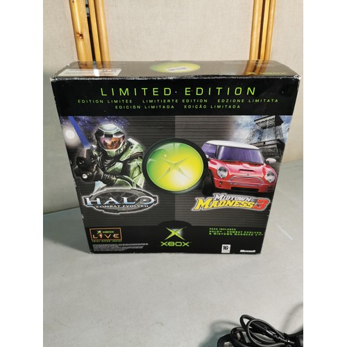 17 - A boxed original Xbox games console along with a Logic3 controller and includes cables. In excellent... 