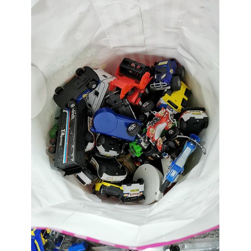 16 - A large collection of toys including die cast vehicles and figures, including many plastic McDonald ... 