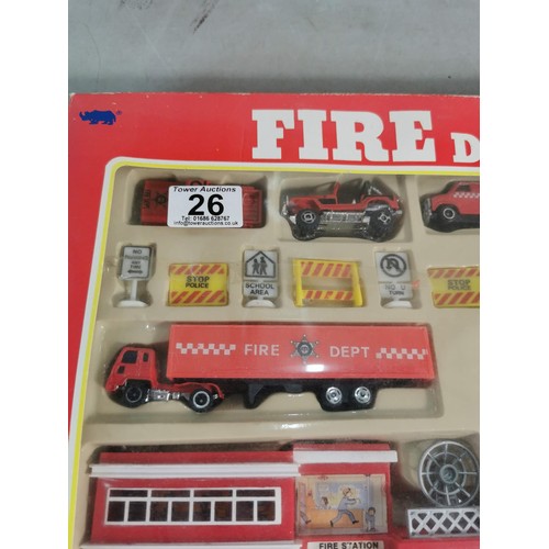 26 - A diecast model fire engine scene, vintage set, never been opened.