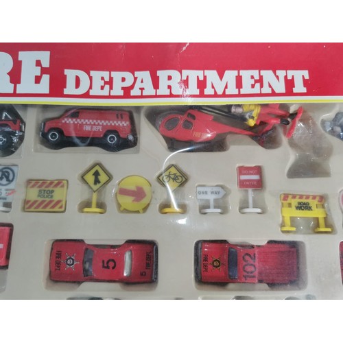 26 - A diecast model fire engine scene, vintage set, never been opened.