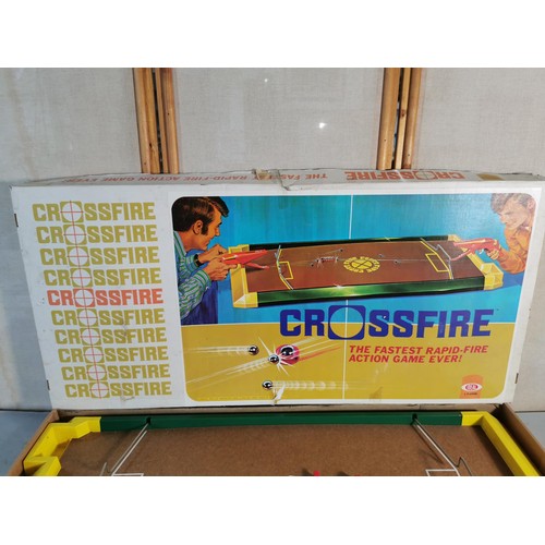 27 - A vintage crossfire game set by Ideal, in good order missing its balls