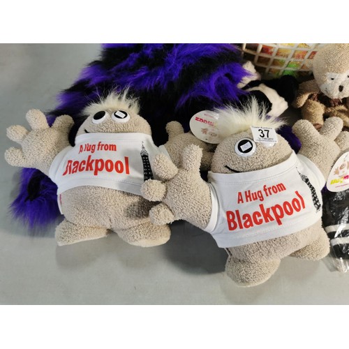 37 - A large quantity of soft plush toys inc 2 Hugmozz hug from Blackpool plushes, a purple and black cat... 