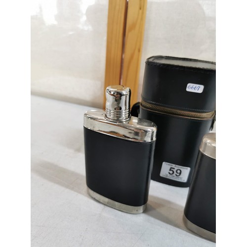 69 - Cased set of 2 x hip flasks, in original case, one hip flask has original stopper, both in good orde... 