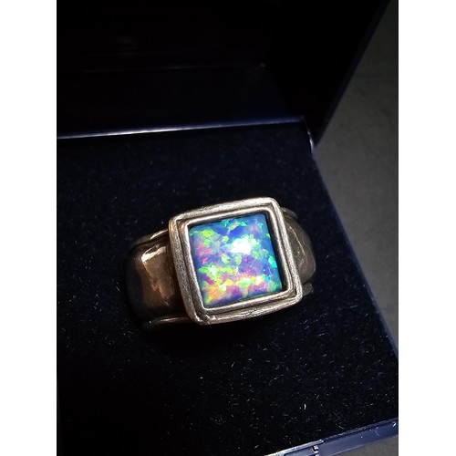 297 - A good vintage arts and crafts handmade sterling silver blue opal ring inset with a large cushion cu... 