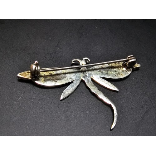 298 - A pretty vintage 925 silver may fly brooch inset with mother of pearl rings and marcasite stones, co... 