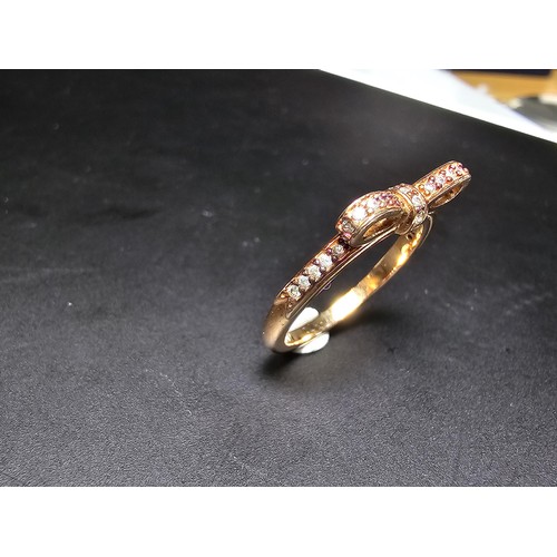 301 - A genuine Pandora as new unused rose gold ring with a bow design inset with clear crystals, marked A... 