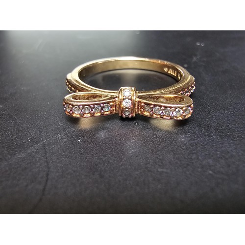 301 - A genuine Pandora as new unused rose gold ring with a bow design inset with clear crystals, marked A... 