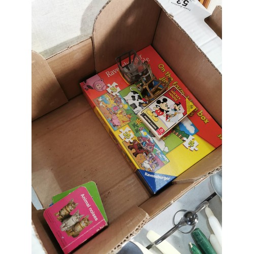 53 - A box of odds to include candles, candlesticks, crayons, a wooden toy shape box, children's books, a... 