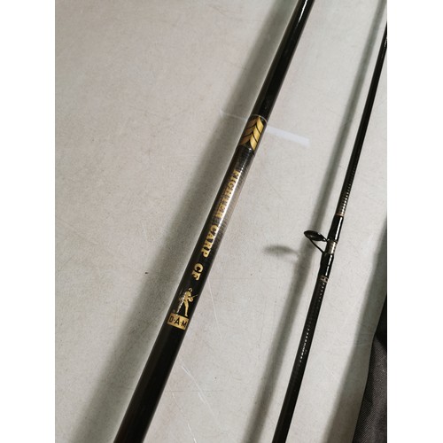 11 - A carp fighter CFDAM fishing rod with a Shakespeare black demon cover. In good overall condition.