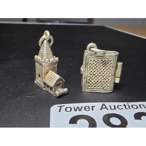 283 - 2 good quality vintage tested as sterling silver charms for a charm bracelet which includes a church... 