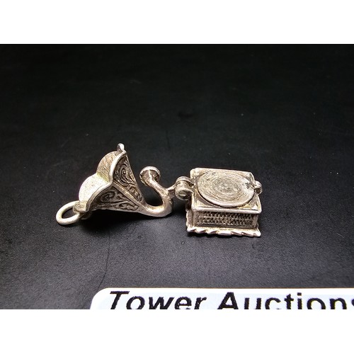 284 - 2 good quality vintage tested as sterling silver charms for a charm bracelet which includes a gramop... 