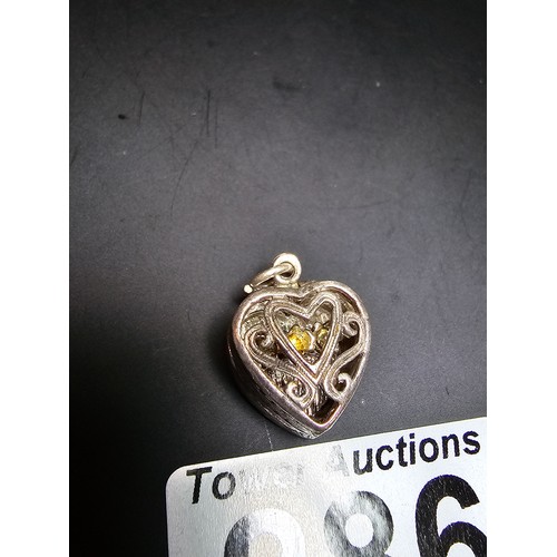 286 - 2 good quality vintage tested as sterling silver charms for a charm bracelet which includes a silver... 