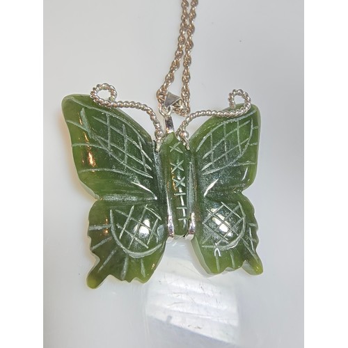 307A - A good quality vintage genuine nephrite jade carved butterfly pendant with overlaid silver antennae ... 