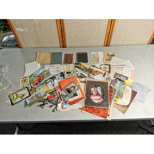 91 - A large quantity of various ephemera to include vintage postcards, a quantity of postcard/photo slee... 