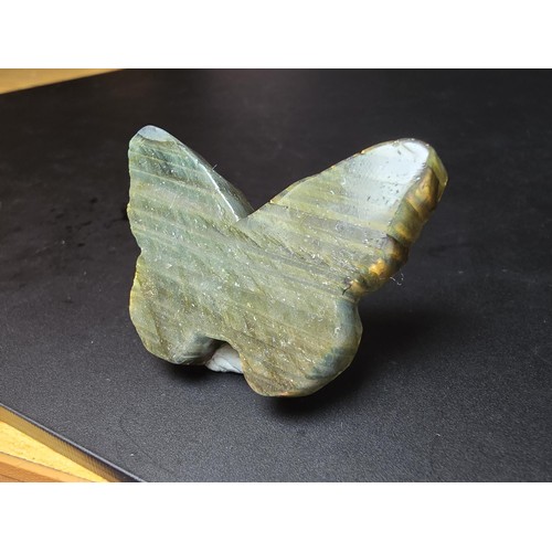 319 - A beautiful natural labradorite carved butterfly with a carved skull to the centre, presenting excel... 