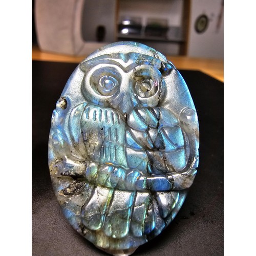 321 - A beautiful natural labradorite carved owl plaque presenting excellent natural flashing colours thro... 