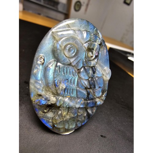 321 - A beautiful natural labradorite carved owl plaque presenting excellent natural flashing colours thro... 