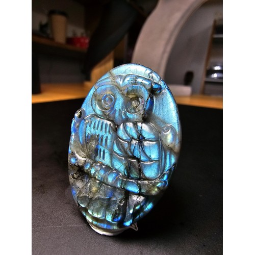 321 - A beautiful natural labradorite carved owl plaque presenting excellent natural flashing colours thro... 