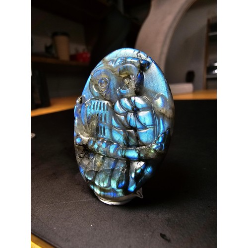 321 - A beautiful natural labradorite carved owl plaque presenting excellent natural flashing colours thro... 