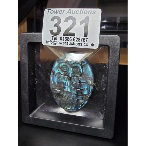 321 - A beautiful natural labradorite carved owl plaque presenting excellent natural flashing colours thro... 