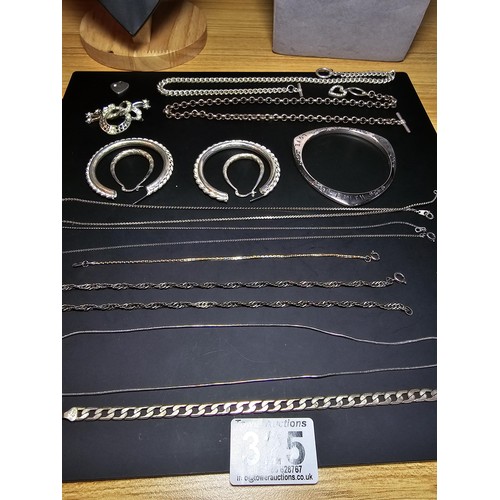 325 - A large collection of various silver plated items which includes 2 good pocketwatch chains, a curb l... 