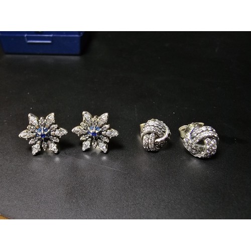 198 - 2 pairs of genuine Pandora 925 silver earrings, 1 pair is in star form with clear and blue crystals,... 