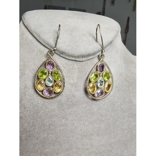 199 - A stunning pair of vintage 925 sliver drop earrings inset with many genuine faceted gemstones which ... 