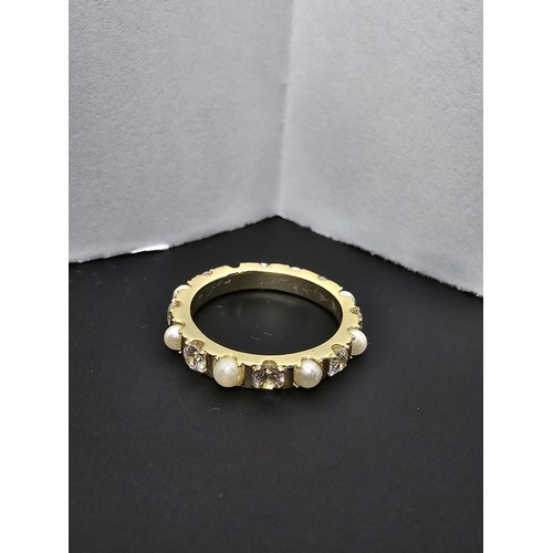 201 - A pretty gold plate on 925 silver eternity ring featuring faux pearls and cz crystal stones all the ... 