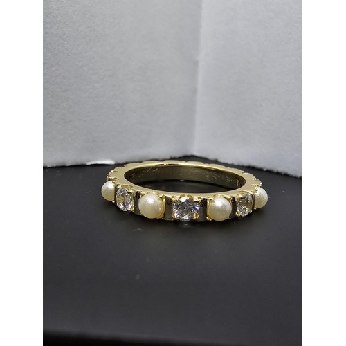 201 - A pretty gold plate on 925 silver eternity ring featuring faux pearls and cz crystal stones all the ... 