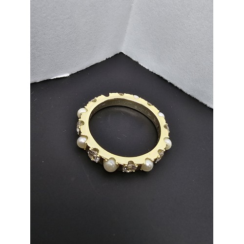 201 - A pretty gold plate on 925 silver eternity ring featuring faux pearls and cz crystal stones all the ... 