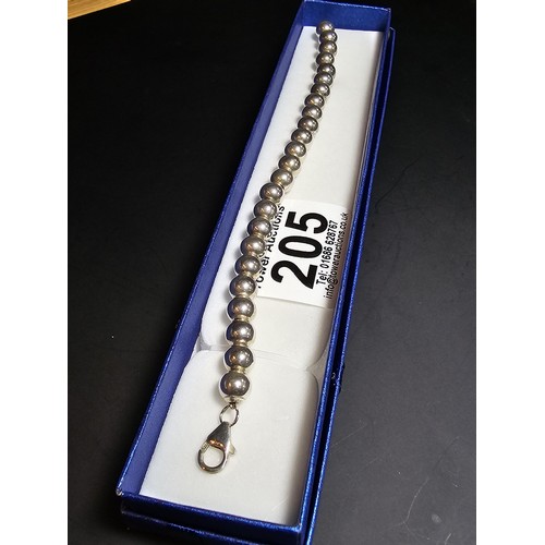 205 - A good quality heavy 925 hallmarked silver large ball beaded bracelet, in new and unused condition a... 