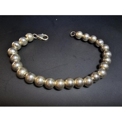 205 - A good quality heavy 925 hallmarked silver large ball beaded bracelet, in new and unused condition a... 