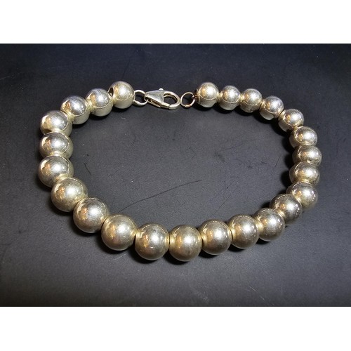 205 - A good quality heavy 925 hallmarked silver large ball beaded bracelet, in new and unused condition a... 