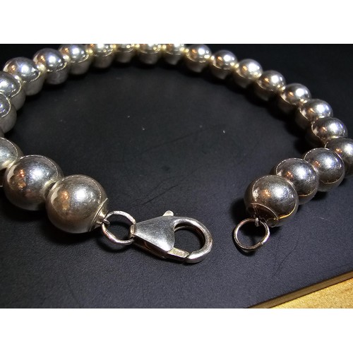 205 - A good quality heavy 925 hallmarked silver large ball beaded bracelet, in new and unused condition a... 