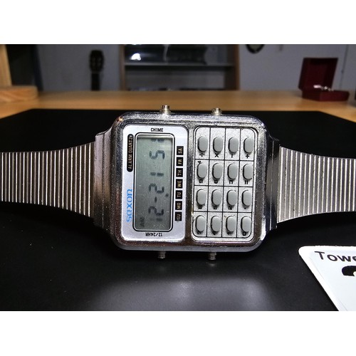 208 - A vintage digital calculator watch by Saxon, the watch is in excellent clear condition with a metal ... 
